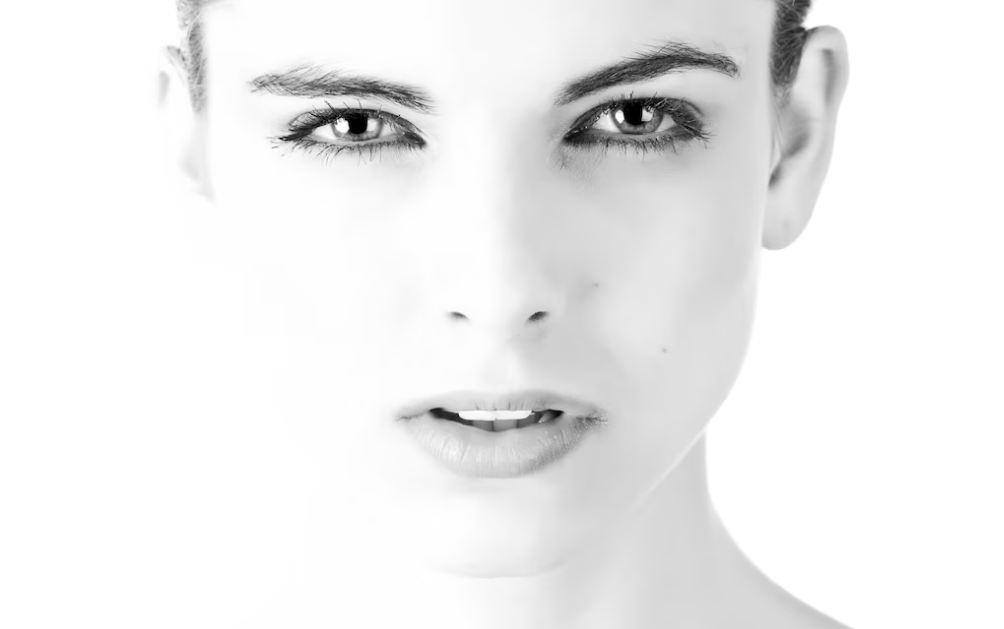 black and white portrait of a woman with white background