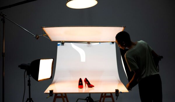 A woman taking a picture of shoes